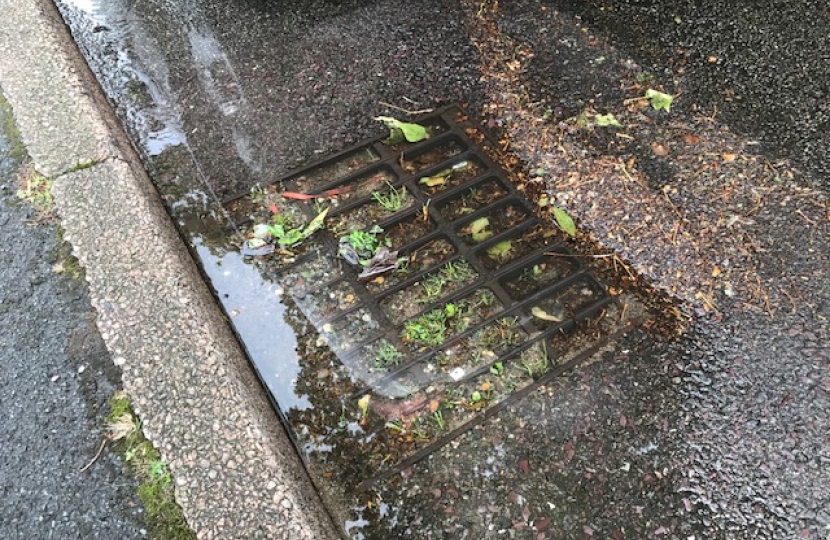 Flooded street drains in Birstall